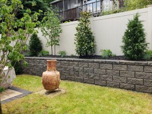 samll ceramic back yard fireplace retaining wall garden and fencing in Fort Lee NJ