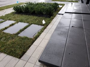 stone walkway and landscaping augment the pavers and stone benches in the commercial landscaping in Fort Lee NJ