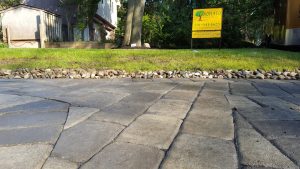 a walk way with a natural stome retaining wall in Tenafly NJ 3